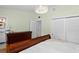 Bright bedroom featuring hardwood floors, stylish dresser, and contemporary lighting at 625 Worthington Dr, Winter Park, FL 32789
