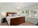 Bedroom with a large window, wood floors, and a chandelier lighting at 625 Worthington Dr, Winter Park, FL 32789