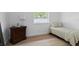 Bedroom with a twin bed, hardwood flooring, and a light and airy atmosphere at 625 Worthington Dr, Winter Park, FL 32789