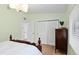 Bedroom showcasing a bed, closet with louvered doors, and a bright window at 625 Worthington Dr, Winter Park, FL 32789