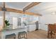 Inviting kitchen with barstool seating, modern countertops, stainless appliances, and a nearby dining area at 625 Worthington Dr, Winter Park, FL 32789