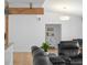 Living room with a structural beam, hardwood floors, and leather furniture at 625 Worthington Dr, Winter Park, FL 32789