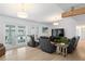 Open living room featuring hardwood floors, comfy seating, and lots of natural light at 625 Worthington Dr, Winter Park, FL 32789