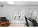 Bright living room with French doors opening to outdoor seating area at 625 Worthington Dr, Winter Park, FL 32789