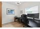 Home office space featuring a large desk, monitor, and natural light from the window at 625 Worthington Dr, Winter Park, FL 32789