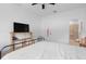 Bright bedroom features a metal bed frame with wooden accents and a ceiling fan at 663 Fairview Ave, Haines City, FL 33844