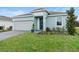 Charming single-Gathering home featuring a well-manicured lawn, attached two-car garage, and pleasant curb appeal at 663 Fairview Ave, Haines City, FL 33844