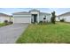 Charming single-Gathering home with a neatly maintained lawn, brick paved driveway, and welcoming curb appeal at 663 Fairview Ave, Haines City, FL 33844