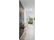 Bright hallway with tile floors, stylish decorations, and a view into the adjacent living room at 663 Fairview Ave, Haines City, FL 33844