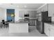 Modern kitchen with granite countertops, stainless steel appliances, and an island at 663 Fairview Ave, Haines City, FL 33844