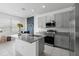 Bright kitchen features granite countertops, stainless steel appliances, and a center island at 663 Fairview Ave, Haines City, FL 33844