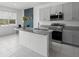 Modern kitchen with granite countertops, stainless steel appliances, and gray cabinets at 663 Fairview Ave, Haines City, FL 33844