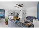 Spacious living room flowing into a kitchen, featuring modern decor and a view of the open floor plan at 663 Fairview Ave, Haines City, FL 33844