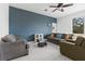 Cozy living room with a blue accent wall and a large window at 663 Fairview Ave, Haines City, FL 33844