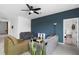 Stylish living room with tiled floors, modern furniture, and a view into an adjacent room at 663 Fairview Ave, Haines City, FL 33844
