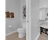 A simple bathroom with a toilet and brown decor at 7419 Marker Ave, Kissimmee, FL 34747