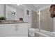 Well-lit bathroom featuring a granite vanity and walk-in glass shower at 7419 Marker Ave, Kissimmee, FL 34747