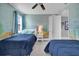 bedroom with fun under the sea wall decor and 2 twin beds for guests at 7419 Marker Ave, Kissimmee, FL 34747