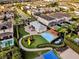 An aerial view reveals a playground, splash pad, and community amenities in a Gathering-friendly neighborhood at 7419 Marker Ave, Kissimmee, FL 34747