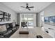 Spacious living room featuring tile flooring, neutral walls, and sliding glass doors to the backyard at 7419 Marker Ave, Kissimmee, FL 34747