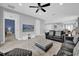 Open living area with tile floors, a ceiling fan, and a comfortable seating arrangement at 7419 Marker Ave, Kissimmee, FL 34747