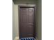 Unit 470's front entrance door is a solid, paneled design with modern hardware at 860 N Orange Ave # 470, Orlando, FL 32801