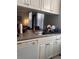 Kitchen sink and countertop with a view into the living room, with neutral colors at 860 N Orange Ave # 470, Orlando, FL 32801