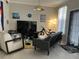 Bright living room with modern furniture, including a sofa, chair, and entertainment center at 860 N Orange Ave # 470, Orlando, FL 32801