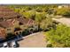 Scenic aerial shot of residences with tile roofs, landscaped grounds, and dedicated parking areas in a community at 8990 Cuban Palm Rd, Kissimmee, FL 34747