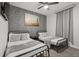 Bedroom with two beds and a brick accent wall with decor at 8990 Cuban Palm Rd, Kissimmee, FL 34747
