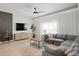 Comfortable living room featuring a large sectional sofa and neutral decor at 8990 Cuban Palm Rd, Kissimmee, FL 34747