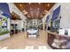 Spacious lobby with high wood ceilings, tile floors, and large windows, plus a reception desk and seating at 8990 Cuban Palm Rd, Kissimmee, FL 34747
