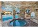 Beautiful community pool area featuring a grotto, waterfall feature, and a relaxing in-ground hot tub at 8990 Cuban Palm Rd, Kissimmee, FL 34747