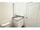Bathroom featuring a granite vanity with a single sink and a white cabinet at 1003 Cascade Dr, Davenport, FL 33837