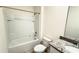Clean bathroom features a tub-shower combination and granite vanity at 1003 Cascade Dr, Davenport, FL 33837