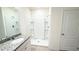 Bathroom with granite countertop, single sink, and walk-in shower stall at 1003 Cascade Dr, Davenport, FL 33837