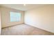 Bright, carpeted bedroom features a window that provides natural light at 1003 Cascade Dr, Davenport, FL 33837