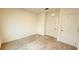 A carpeted bedroom offers a closet and a window for natural light at 1003 Cascade Dr, Davenport, FL 33837