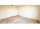 A bright, carpeted bedroom offers a closet and window for natural light at 1003 Cascade Dr, Davenport, FL 33837