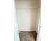 Empty carpeted walk-in closet with white wire shelving at 1003 Cascade Dr, Davenport, FL 33837
