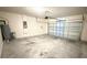 Interior garage with garage door, water heater, and concrete flooring at 1003 Cascade Dr, Davenport, FL 33837