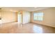 Open living room with tile floors, sliding glass doors to the patio and a window at 1003 Cascade Dr, Davenport, FL 33837