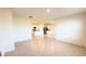 Living room with kitchen view features tile floors and recessed lighting at 1003 Cascade Dr, Davenport, FL 33837