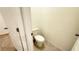 Toilet room with toilet and flooring at 1003 Cascade Dr, Davenport, FL 33837