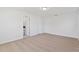 A spacious bedroom with carpeted floors and white walls offering a clean and modern aesthetic at 102 Sail Way, Kissimmee, FL 34759