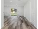 Spacious open-concept living area with sliding glass door and modern flooring at 102 Sail Way, Kissimmee, FL 34759