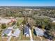 This aerial view shows the home's proximity to the water and nearby neighborhoods at 1112 W Line St, Leesburg, FL 34748