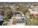 Aerial view of homes in the neighborhood, with several mature trees and green lawns at 1112 W Line St, Leesburg, FL 34748