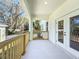 Inviting balcony featuring wooden railings, creating a perfect spot for relaxation and outdoor enjoyment at 1112 W Line St, Leesburg, FL 34748