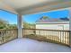 Charming outdoor balcony with wooden railings, providing a serene view of the property's landscape at 1112 W Line St, Leesburg, FL 34748